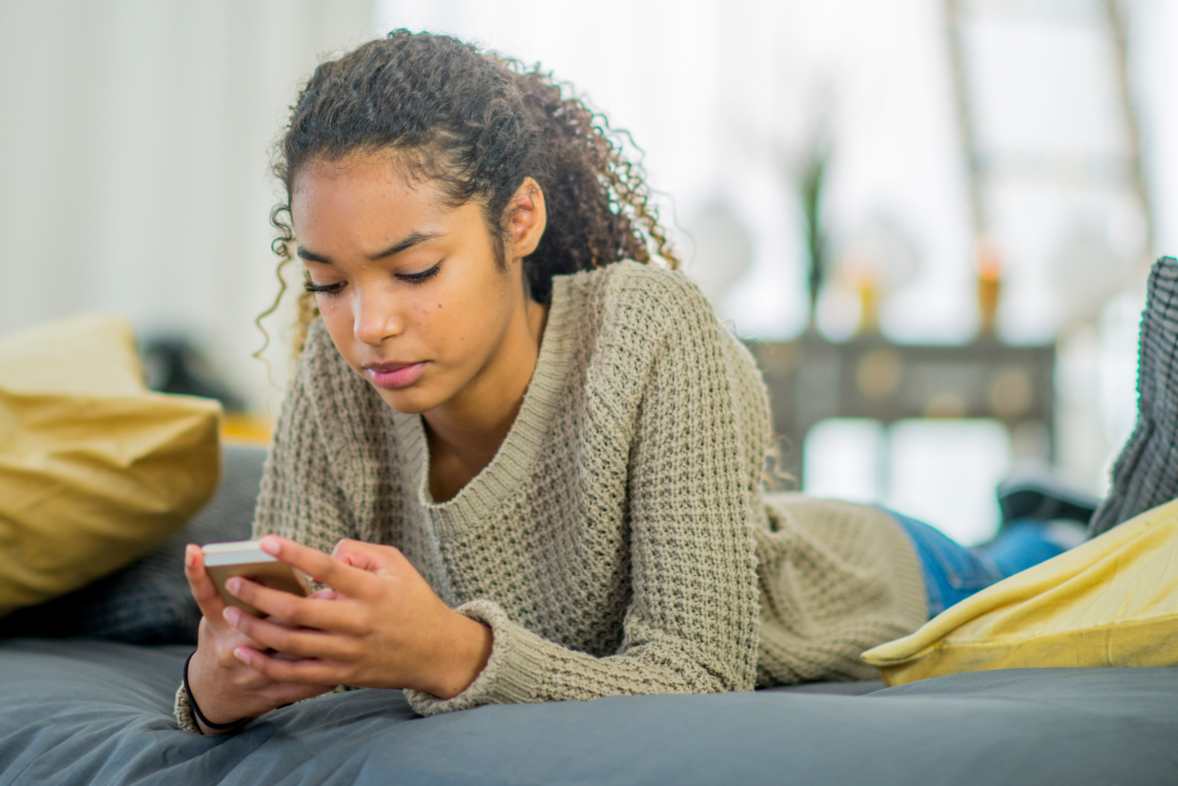 Girl typing on a phone