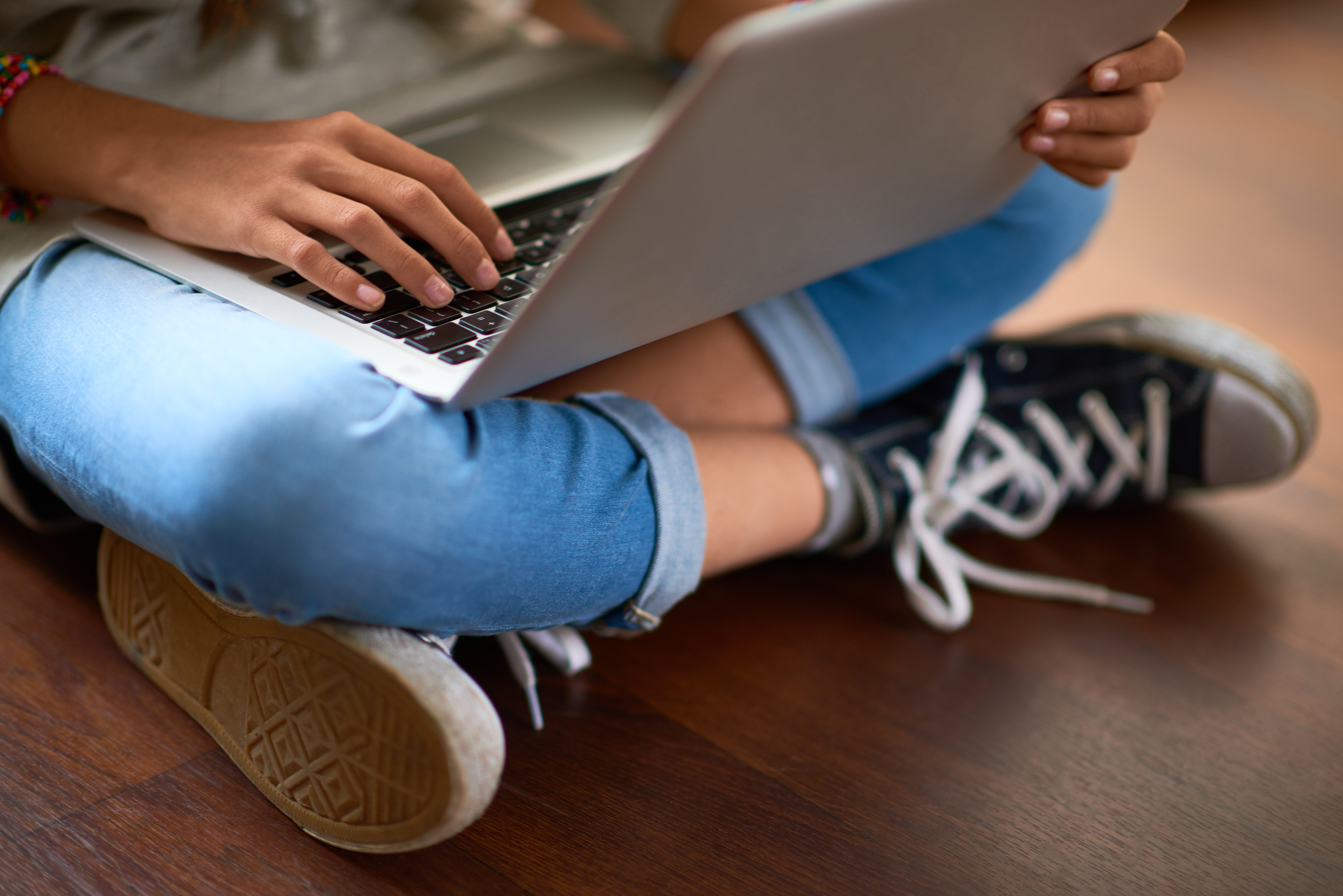 Young person using a laptop computer